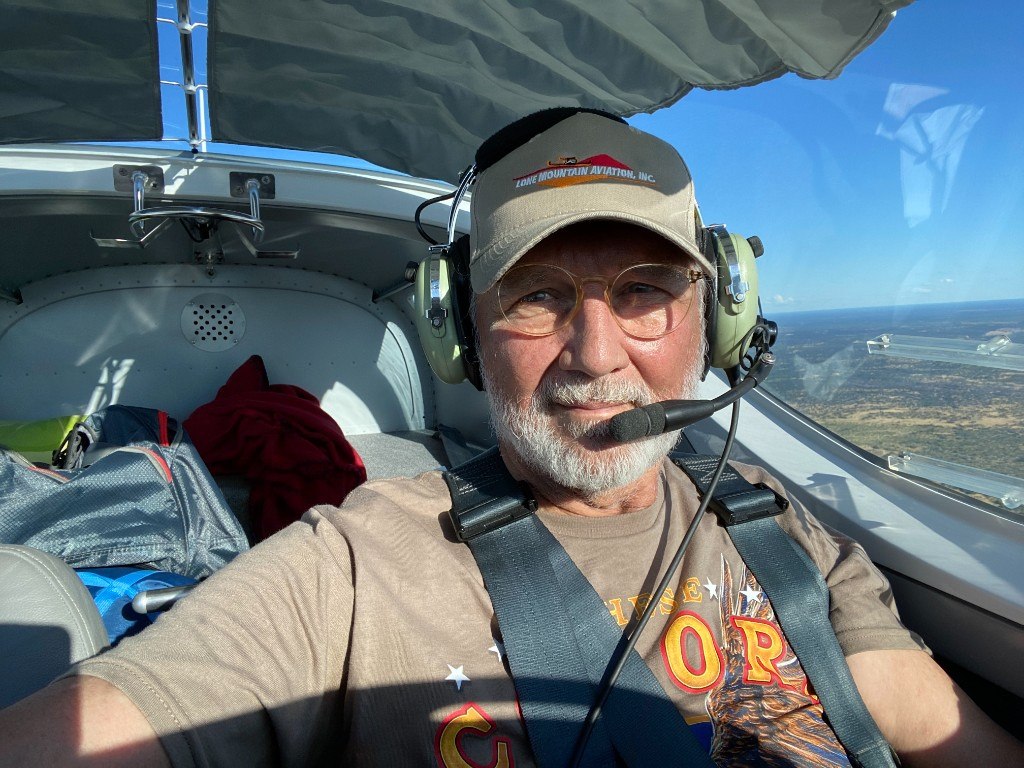 Barry, founder of SuperVan Adventures, in the cockpit of a light aircraft