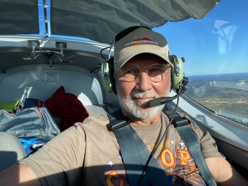 Barry, founder of SuperVan Adventures, in the cockpit of a light aircraft