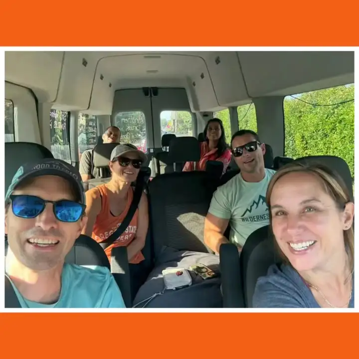 Guests riding together in the van.