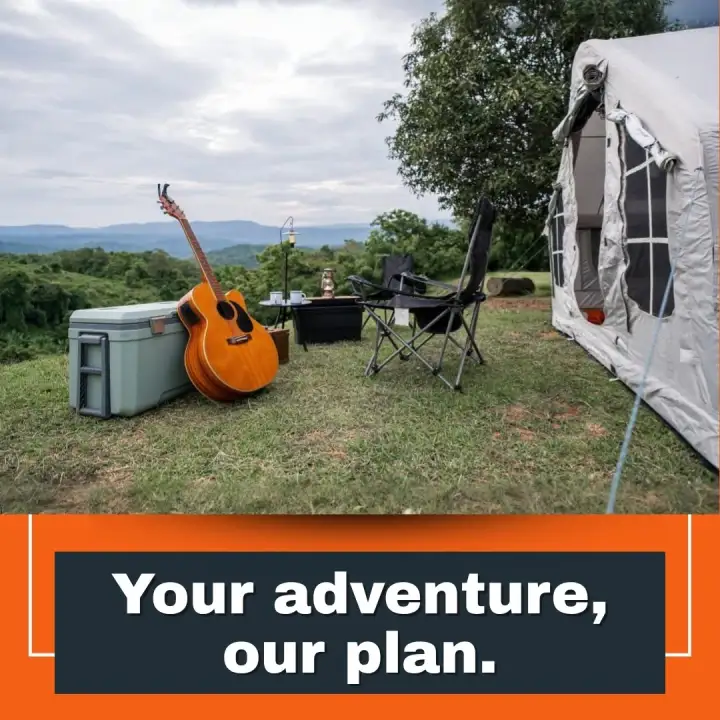 Camp chairs and a tent with a view.
