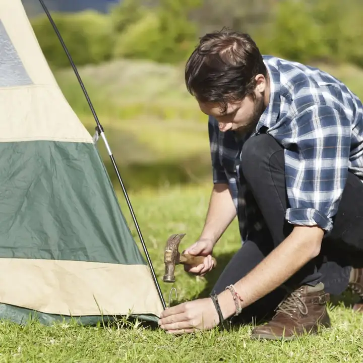 Setting up a tent.