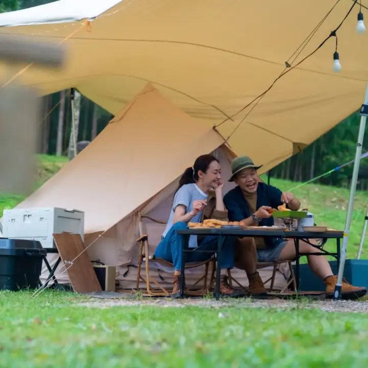 A meal under the camp canopy.